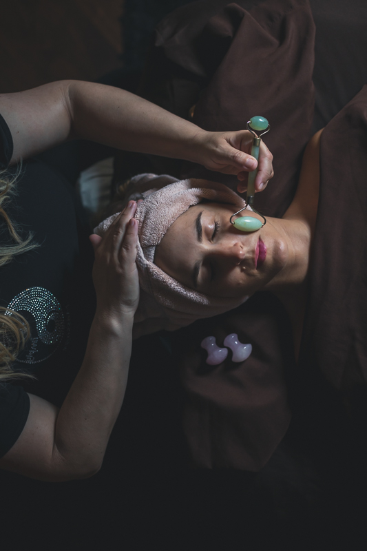 Massage Therapist Smoothing a Client's Face